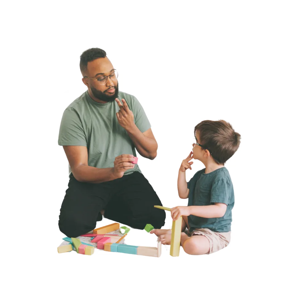 Therapist and child practicing communication during a play activity